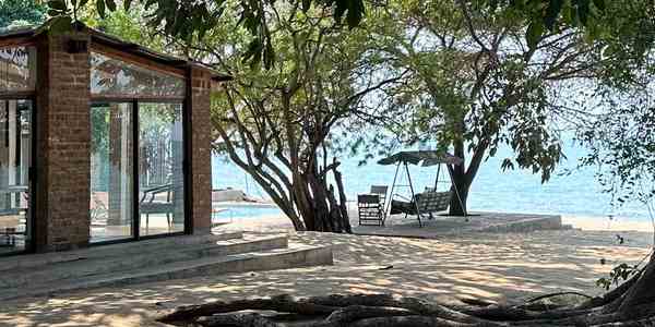 Original Beach House beside the lakeshore and banyan trees